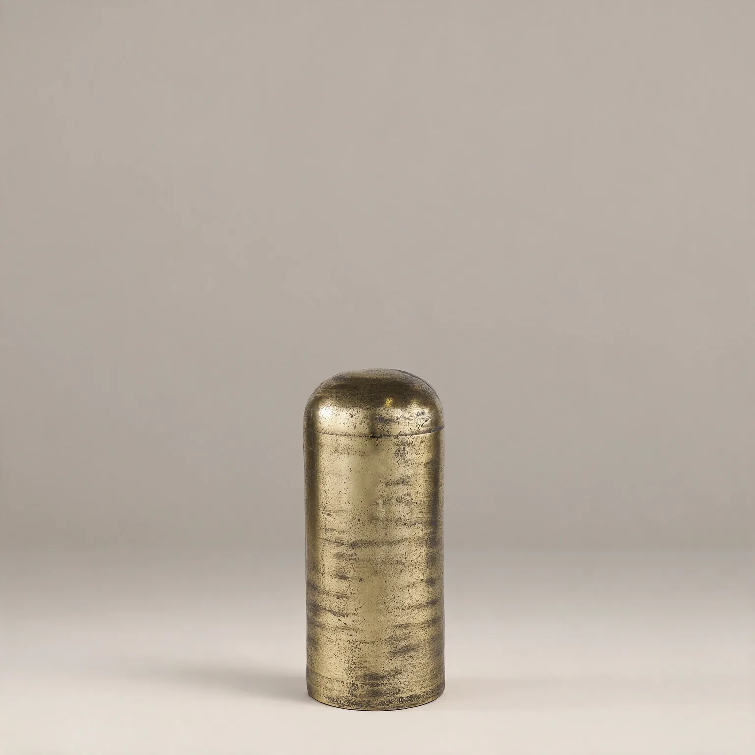 15" Antiqued Brass Cast Aluminum Cylindrical Tabletop Sculpture, front view