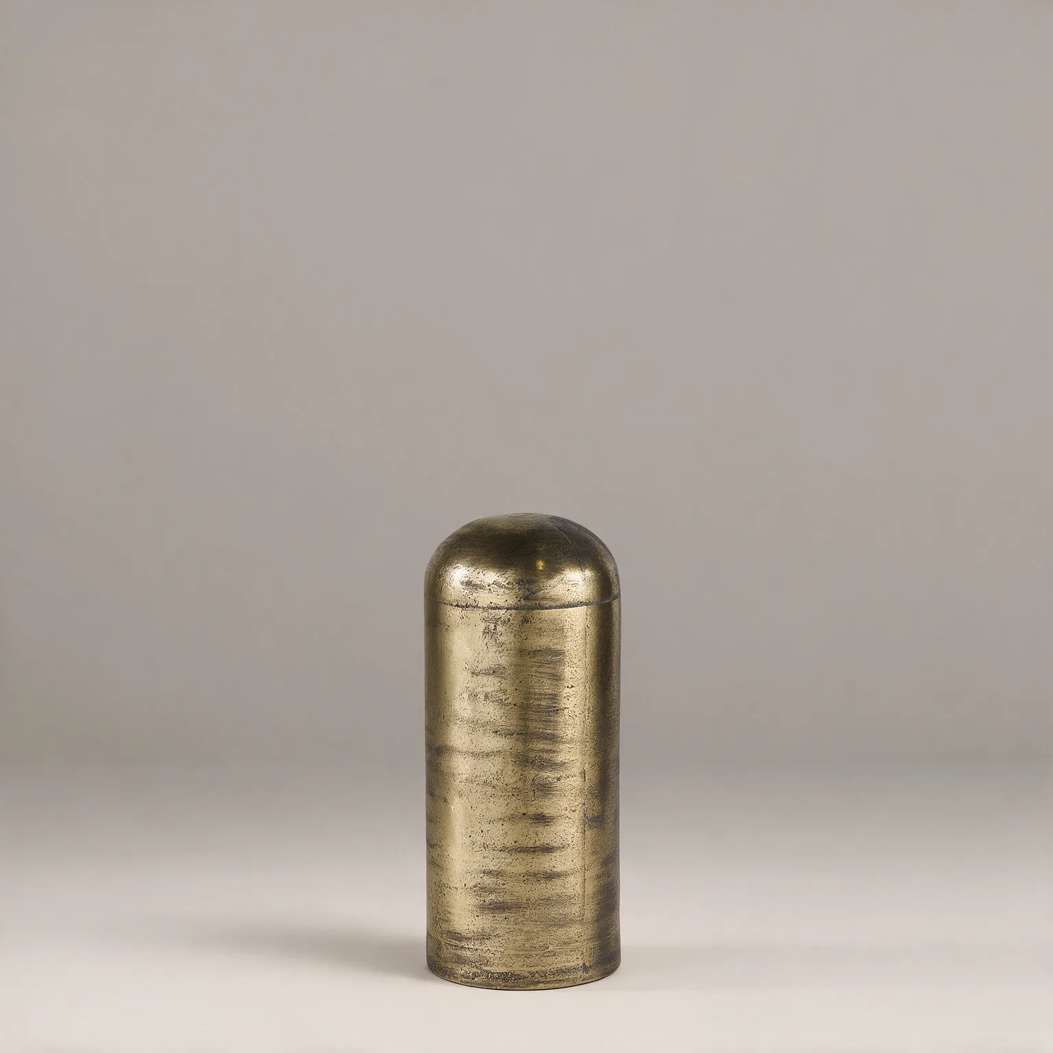 15" Antiqued Brass Cast Aluminum Cylindrical Tabletop Sculpture, three-quarter view