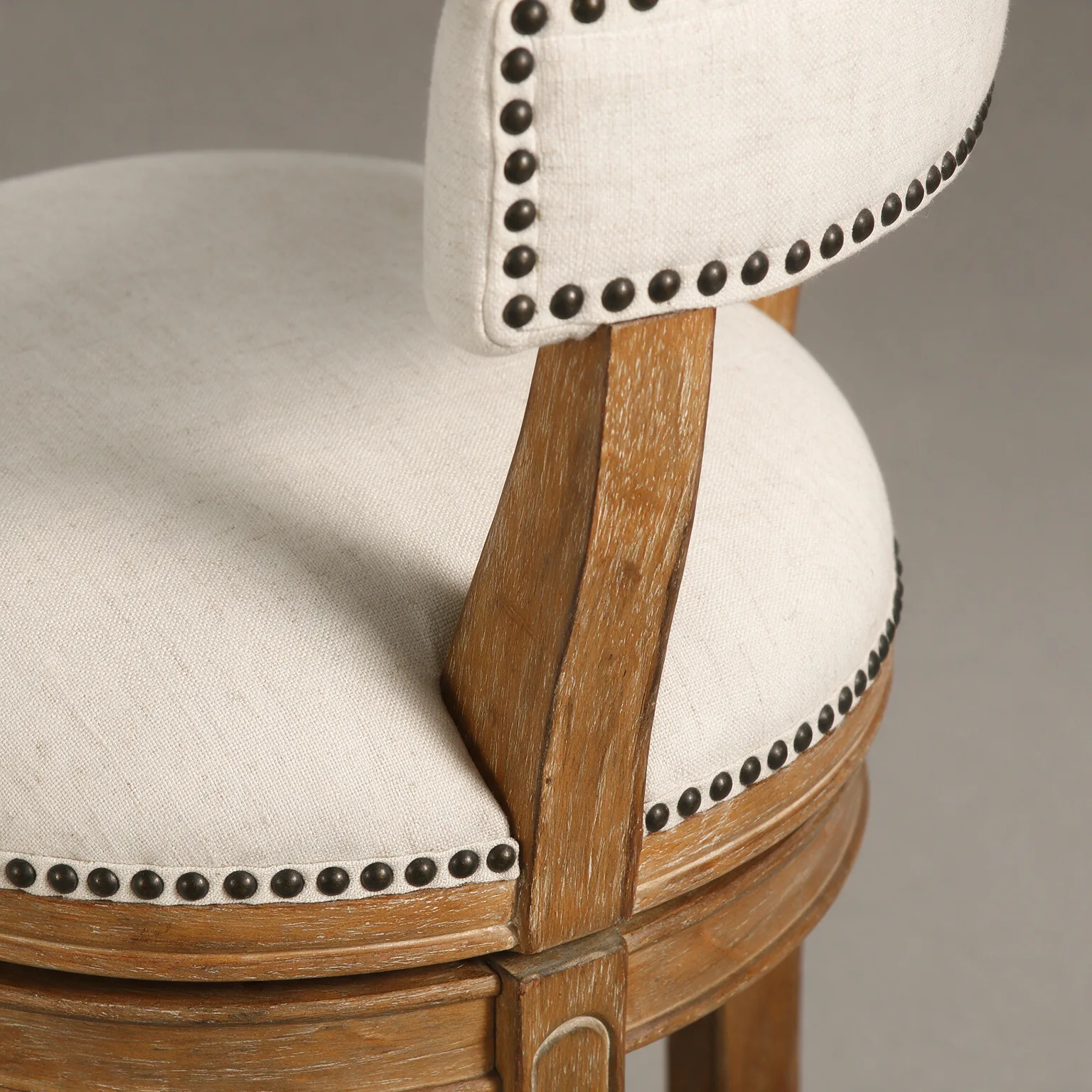 26" Linen And Brown Fabric And Solid Wood Low Back Counter Height Swivel Bar Chair, detail